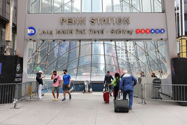 People prepare to enter Penn Station ahead of the Memorial Day weekend in Midtown Manhattan on May 28th, 2021.